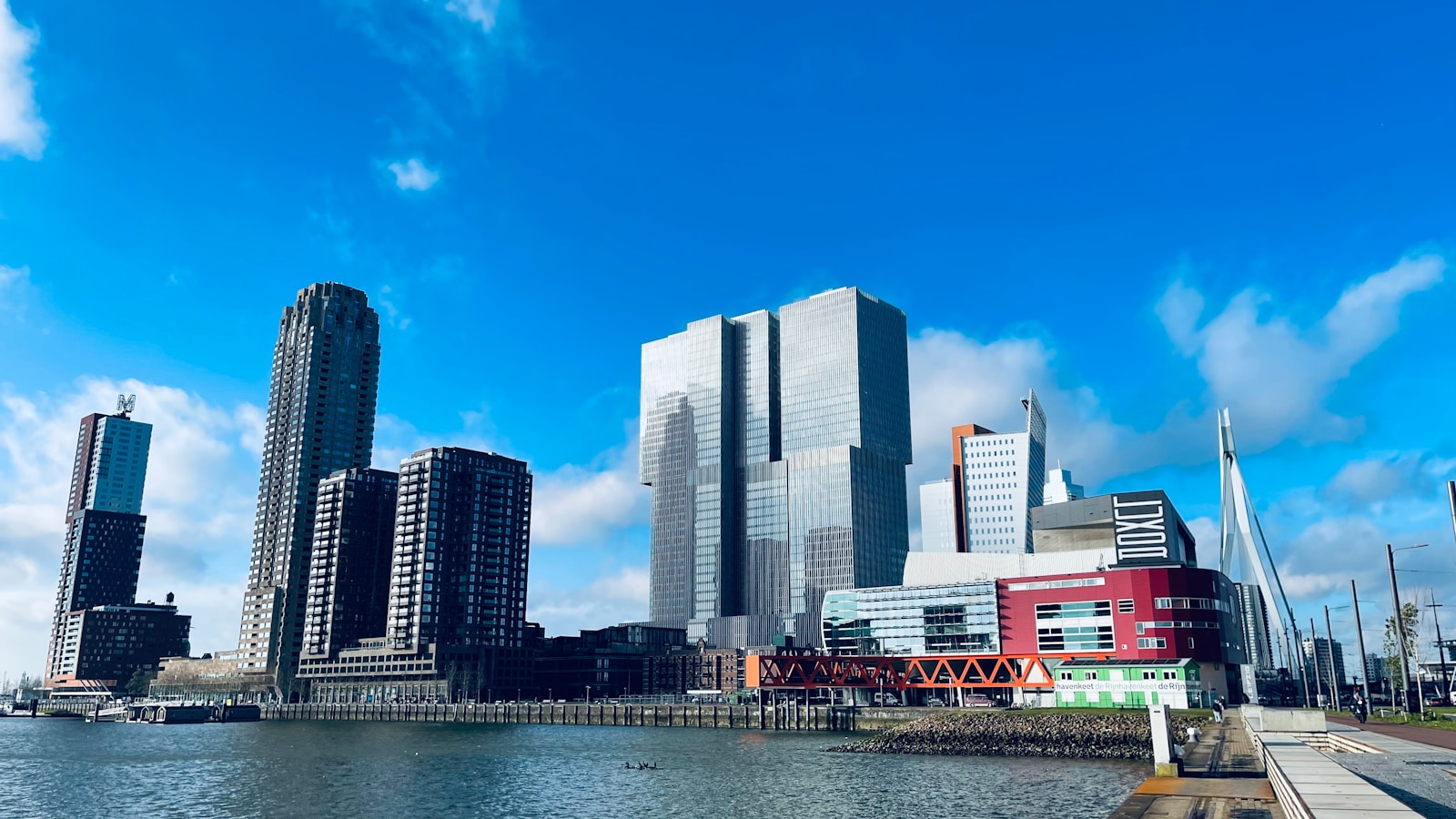 a large body of water with a city in the background