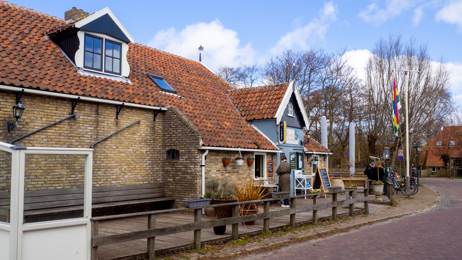 brown and white concrete house under blue sky during daytime